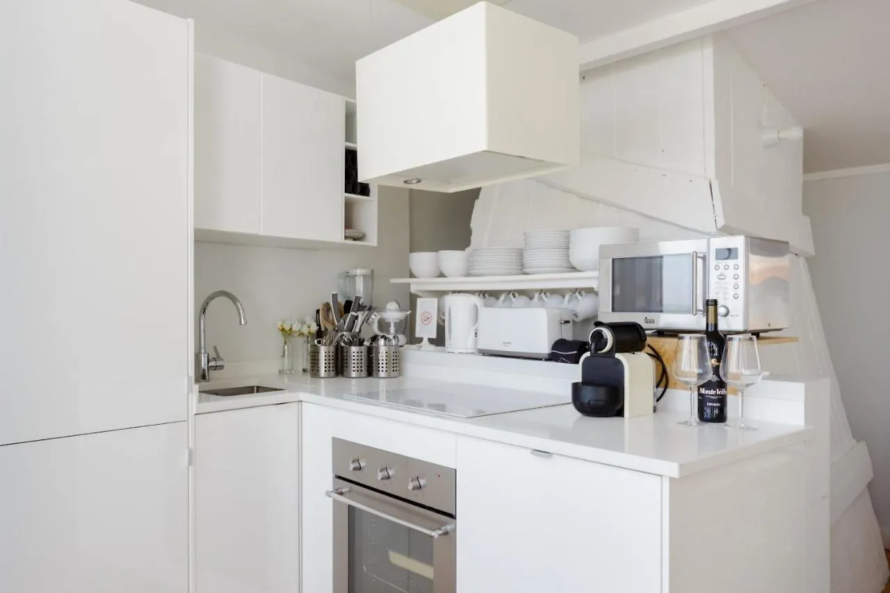 Chiado Rooftop Retreat: 19th Century Charm with River Views Lisbon