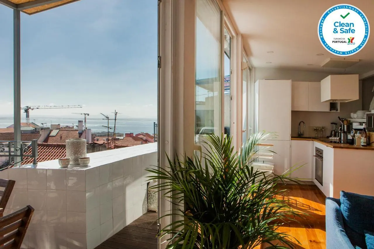 Chiado Rooftop Retreat: 19th Century Charm with River Views Lisbon Apartment
