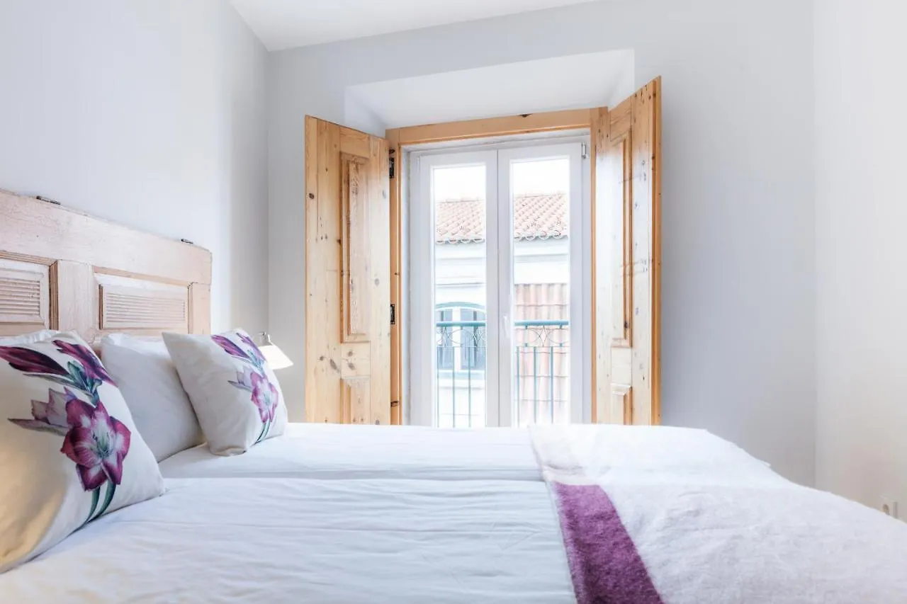 Chiado Rooftop Retreat: 19th Century Charm with River Views Lisbon Apartment