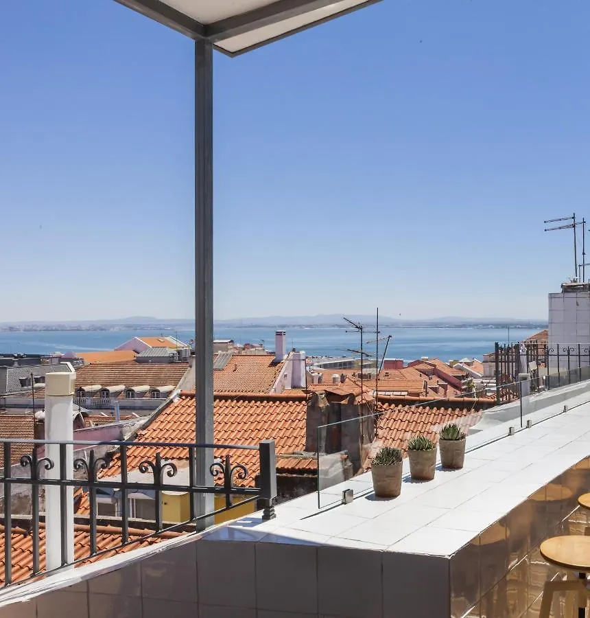 Chiado Rooftop Retreat: 19th Century Charm with River Views Lisbon